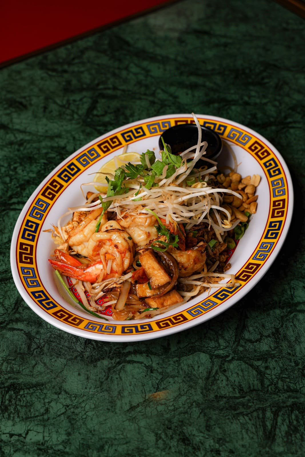 Prawn pad Thai on a patterned plate